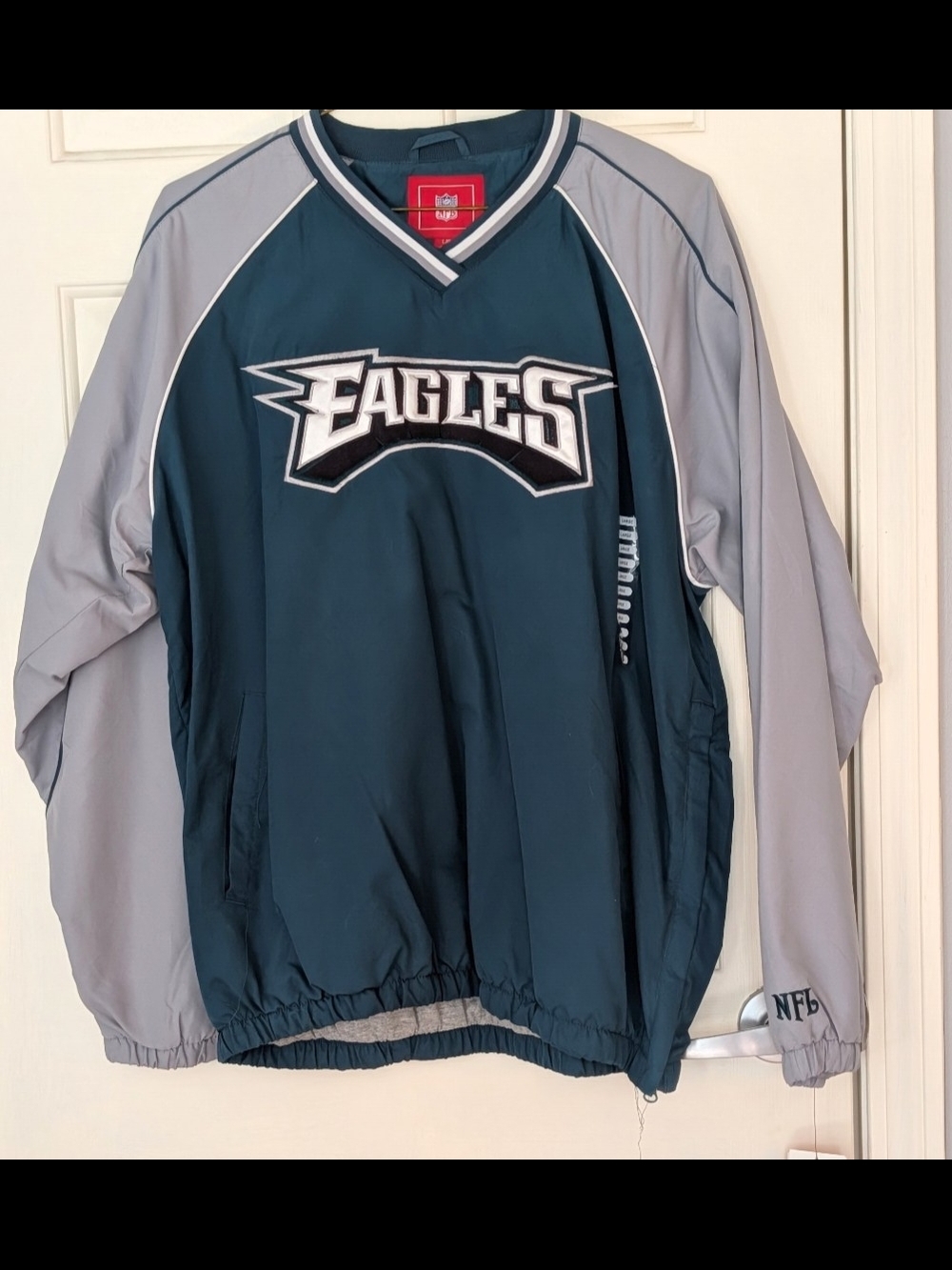 NFL Embroidered Logo Jacket Sleeve in Light Gray with Dark Green Stitching